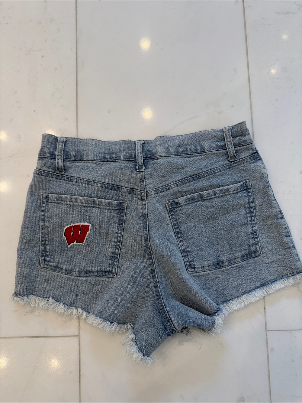Women’s Light blue Denim Frayed Hem Shorts with UW Wisconsin logo on pocket